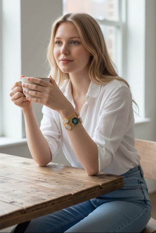 Sheryl, our beautiful model from Decenarios Cool, wearing the Aegean pentarchy cuff, a 24K gold cuff bracelet with 4 Mother of Pearl circles and 1 Blue Agate stone.