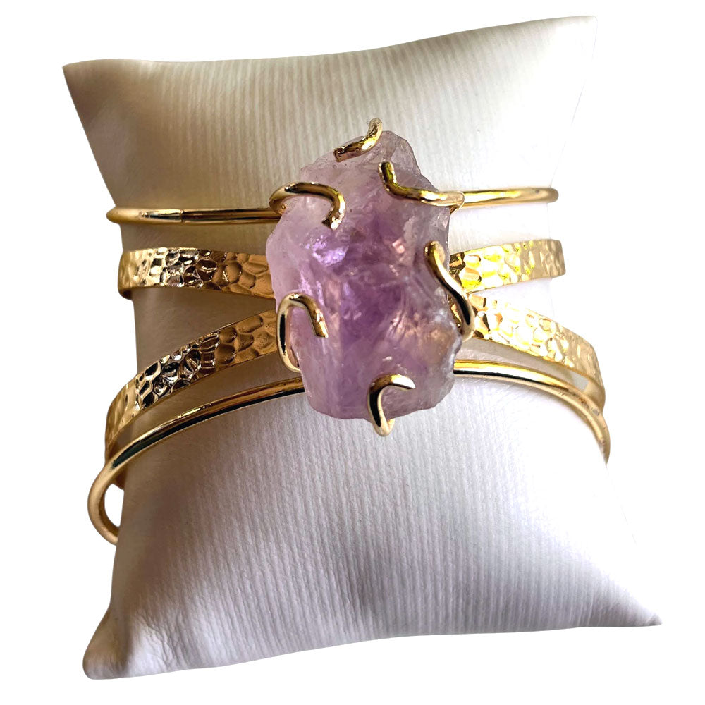 Decenarios Cool 4-row 24K gold plated cuff bracelet with a large raw purple amethyst crystal centerpiece in another pillow, it is very sexy and beautiful.