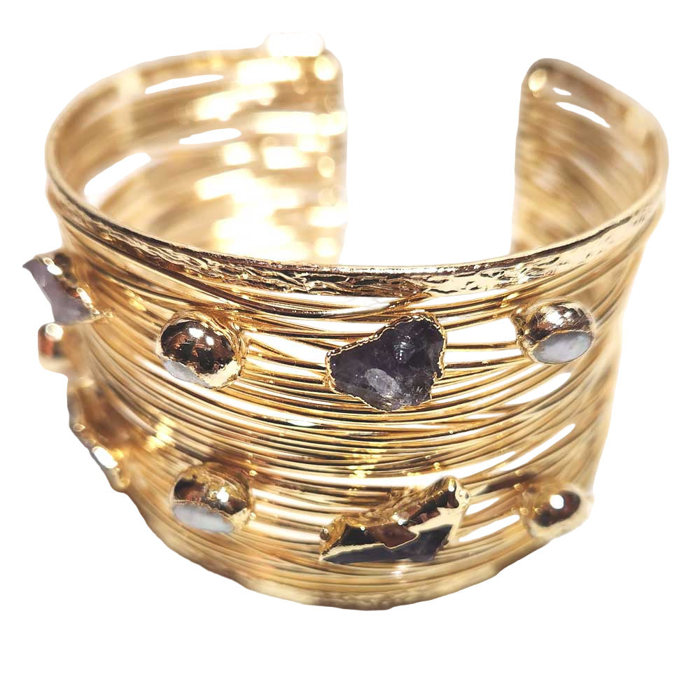 Handcrafted 24K gold-plated brass cuff bracelet with a wire-wrapped, adjustable design and multiple raw-cut amethyst stones