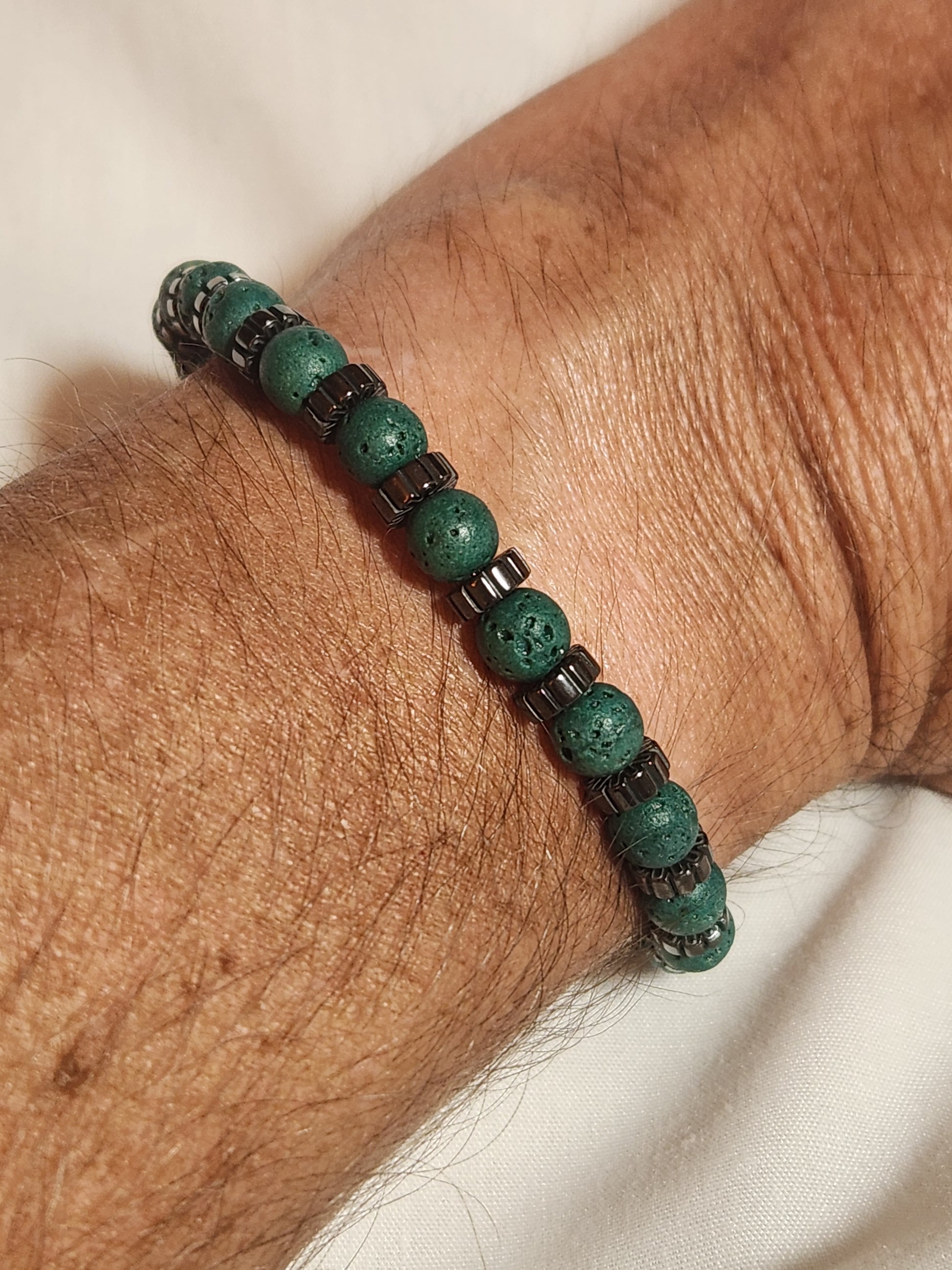 Man wearing the Edgy Green Lava Stone and Hematite Bracelet 7 inch