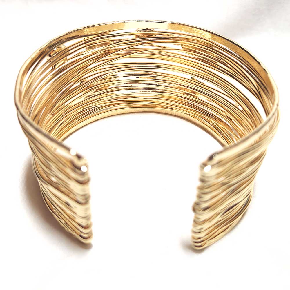 Handcrafted 24K gold-plated brass cuff bracelet with a wire-wrapped - back - closure