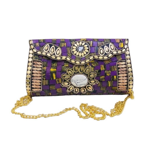 A purple and black patterned clutch bag with gold and silver metallic embellishments, featuring a scalloped flap, a central oval medallion, and a gold chain strap, set against a light gray background.