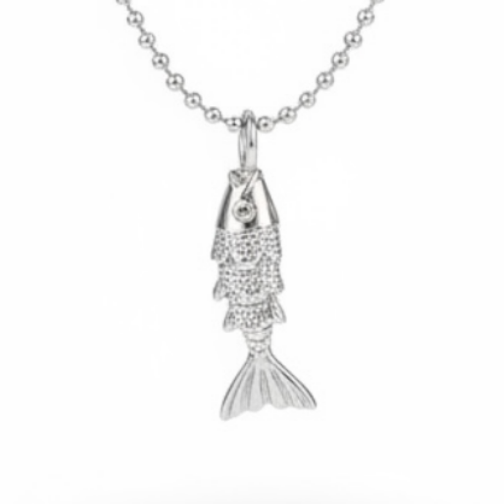 A silver ball-chain necklace with a small fish pendant, shown against a plain white background with a soft shadow underneath.