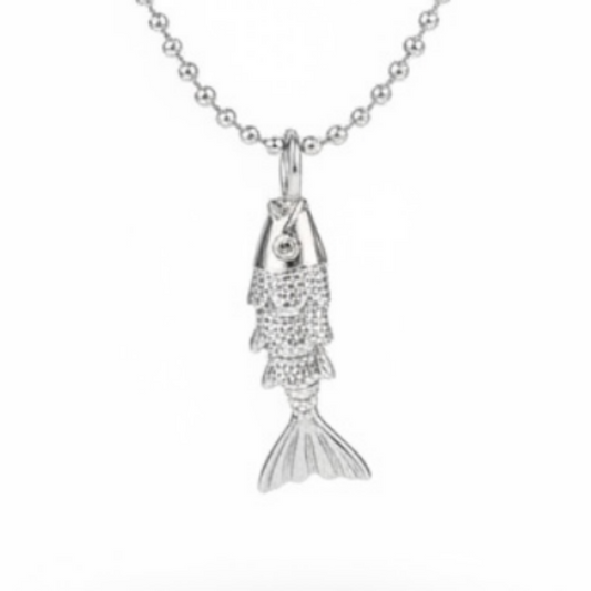 A silver ball-chain necklace with a small fish pendant, shown against a plain white background with a soft shadow underneath.