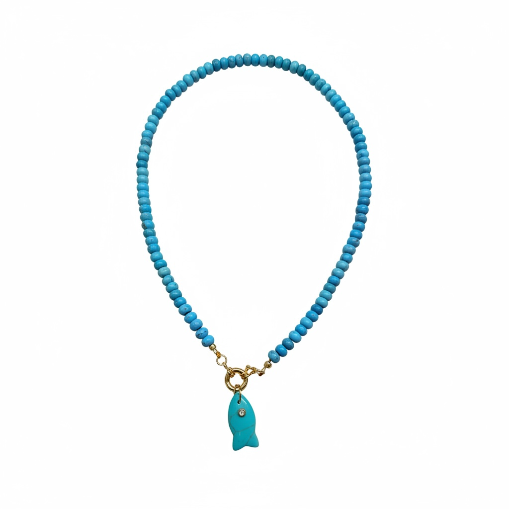 A turquoise beaded necklace with a small turquoise fish pendant and gold-tone clasp, shown on a plain white background.