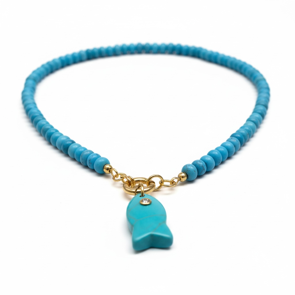 A turquoise blue beaded necklace with a gold-tone chain and a matching turquoise fish-shaped pendant, displayed on a clean white background.