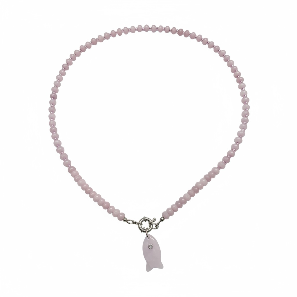 A delicate necklace made of small light pink faceted beads with a silver-toned toggle clasp and a small fish-shaped pendant in a pale pink stone, shown on a plain white background.