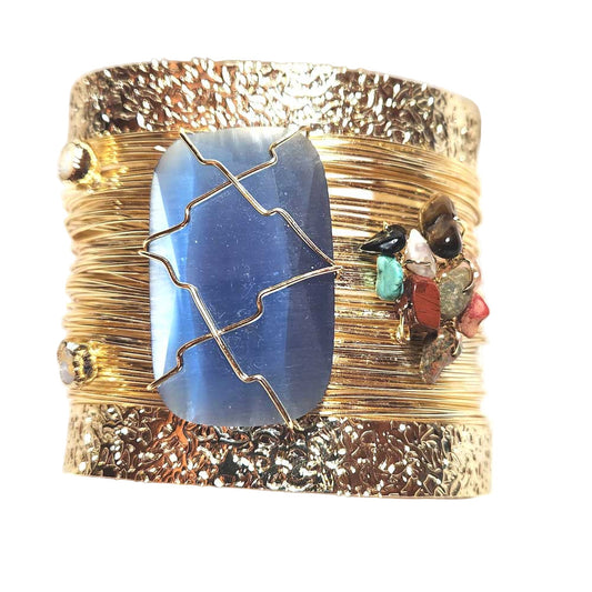 Stunning 24K gold-plated brass cuff bracelet with a large blue agate stone and an assortment of smaller, colorful agate accents.