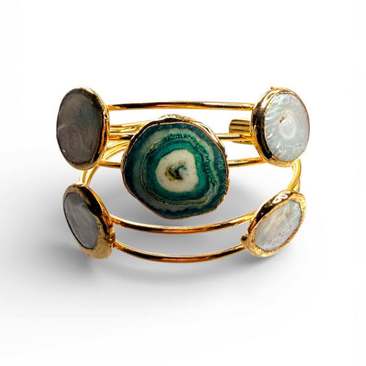 Decenarios Cool 5-row 24K gold cuff bracelet with 4 Mother of Pearl circles and 1 Blue Agate stone.
