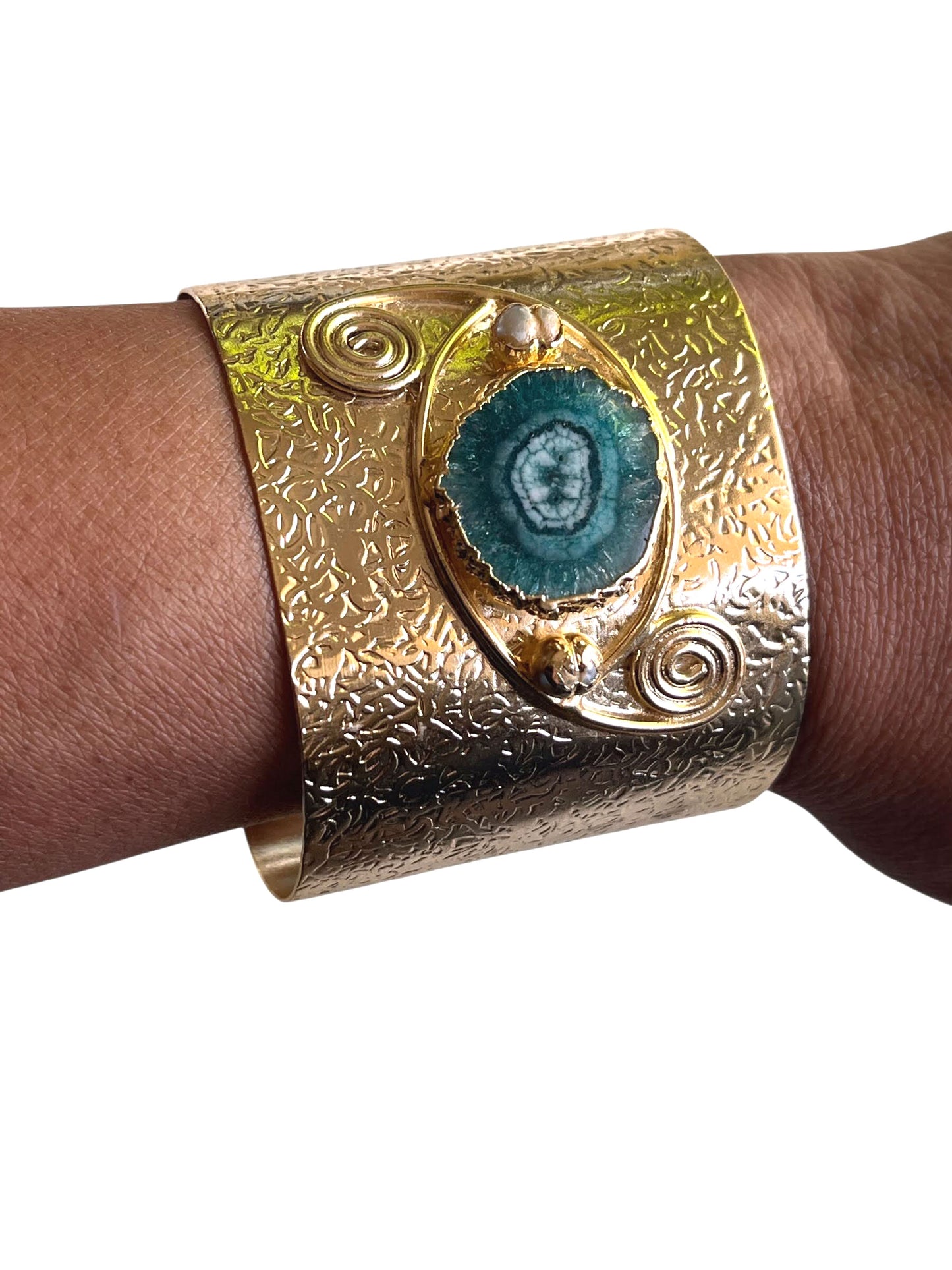 Model wearing Decenarios Cool luxury adjustable bracelet, 24K gold plated brass with irregular green agate stone and Ionian Volutes 